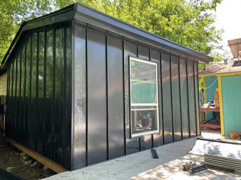 Black standing seam metal wall panels for Roof Inspection in Tacoma