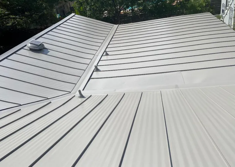 Solar attic fan installed on a metal roof for Roof Ventilation in Tacoma